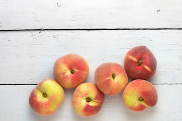 peaches on a white wooden table top view
