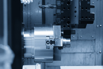 CNC lathe machine (Turning machine) cutting the metal  screw thread part .Hi-precision CNC machining concept.