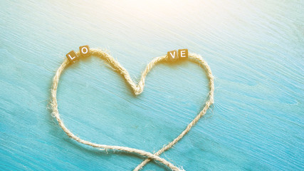 letters on a string in the form of a heart 
