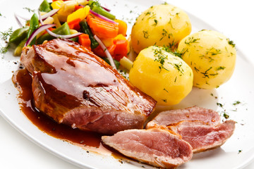 Grilled steak with vegetables on white background