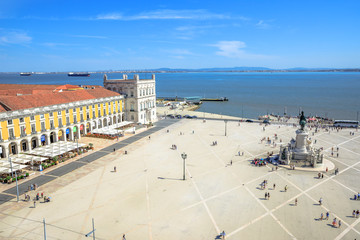 Lisbon, Portugal - August 25, 2017: aerial view from panoramic terrace of Rua Augusta Arch of King Dom Jose I equestrian statues and Tagus River, Praca do Comercio or Commerce Square in Baixa District