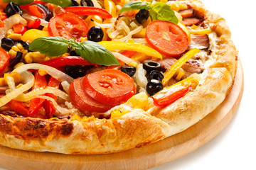 Pizza with ham and vegetables on white background 