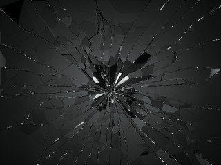 Bullet hole and pieces of shattered or smashed glass
