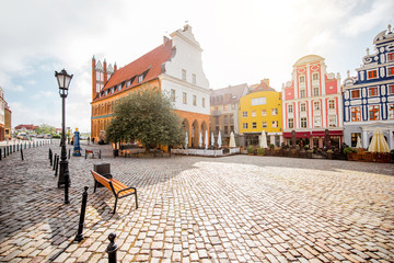 View on the Market square with beautiful colorful buildings during the morning light in Szczecin city, Poland - obrazy, fototapety, plakaty