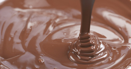 pour milk chocolate from spoon