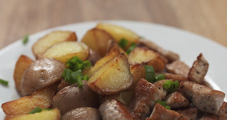 roasted young potatoes with fried pork and green onion