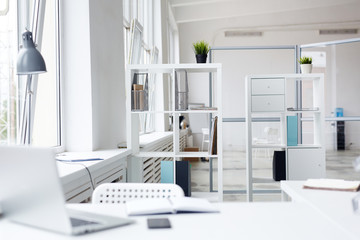 Empty office interior with shelves and workplace of specialist