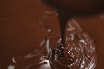 pouring melted premium dark chocolate from above