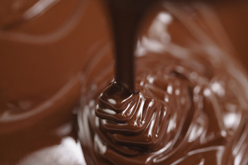pouring melted premium dark chocolate from above