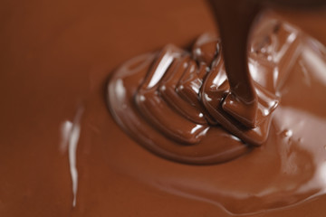 pouring melted premium dark chocolate from above