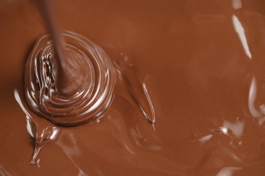 Pouring Melted Premium Dark Chocolate From Above