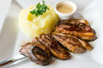 juicy steak veal beef meat with tomato and potatoes