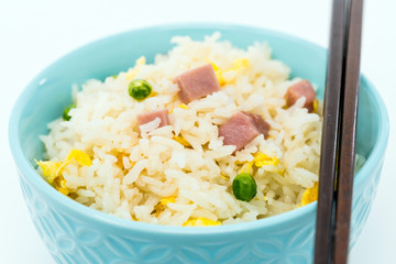 Homemade Chinese fried rice with vegetables and fried eggs