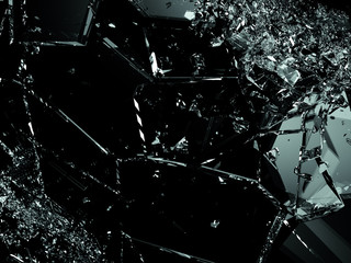 Pieces of splitted or cracked glass on black