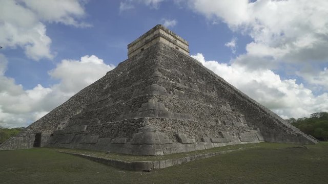 CHICHEN ITZA, MEXICO - MAY 25, 2017: Corner of Maya pyramid temple Kukulkan in peninsula Yucatan at cloudy sunny day