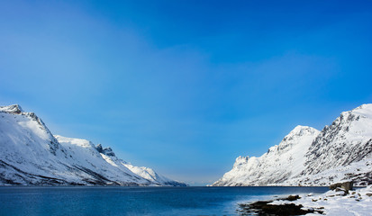 Fototapeta na wymiar Fjord with mountains in Tromsø