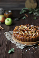 Apple pie on a wooden background