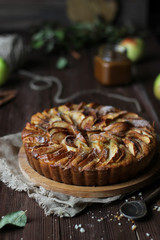 Apple pie on a wooden background