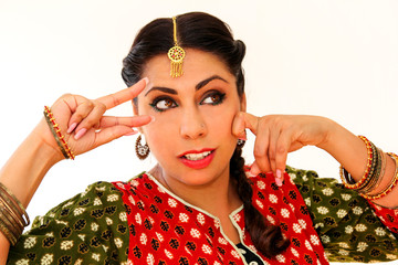 Woman dancing Indian dance in national dress. A beautiful girl portrait in shree kurta patiala set...