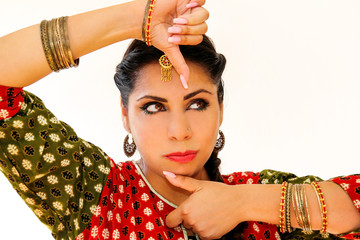 Woman dancing Indian dance in national dress. A beautiful girl portrait in shree kurta patiala set...
