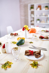 Festive Thanksgiving table prepared for guests in dining-room