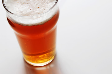 A craft beer (India Pale Ale) on a white table.