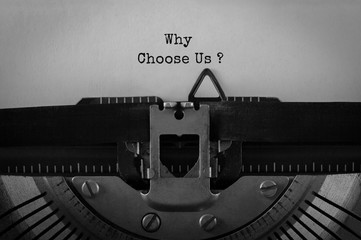 Text Why Choose Us typed on retro typewriter