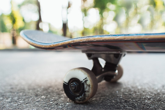 Skateboard on the road. Extreme sport challenge and skateboarder competition, close up picture of skate