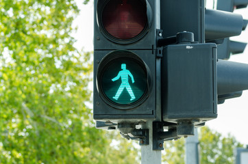 Traffic light, Green traffic light for pedestrians on the crosswalk