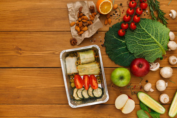 Healthy food delivery background, lunch box on rustic wood