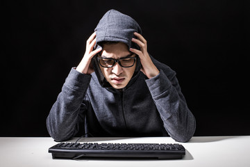 Man Hacker have serious emotion for online Hacking, Man with Hacker Concept.
