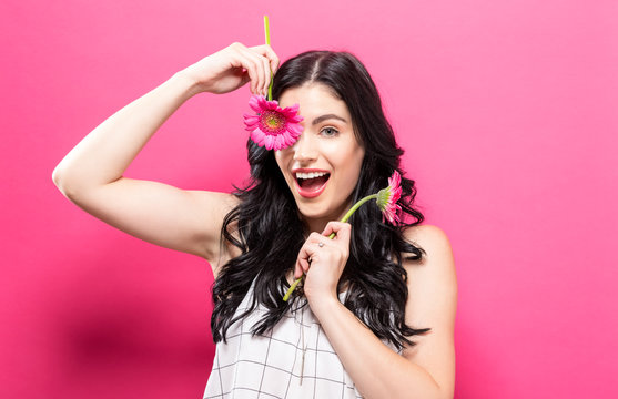 Young woman with garbela on a pink background