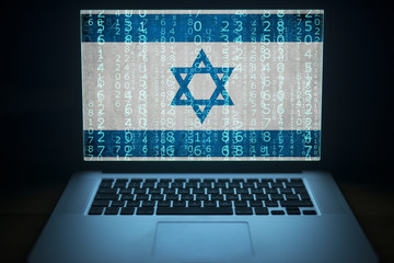 Israeli hacker. Laptop with binary computer code and an Israel flag on the screen. Internet and...