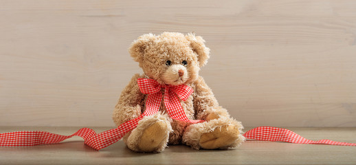 Teddy bear on a wooden floor