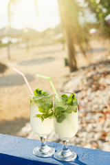 Two glasses of famous Cuban cocktail - Mojito.