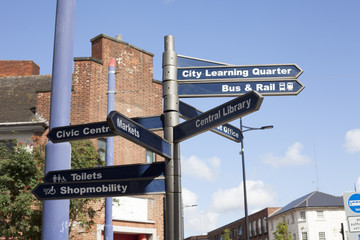 Road sign with many directions