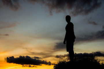 silhouette man on hill with sky for background