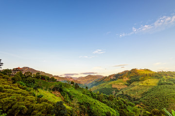 Naklejka premium Beautiful natural landscape sky and sunlight in the morning atmosphere on the high mountain at Doi Mae Salong view point in Chiang Rai Province, Thailand