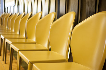 Yellow chairs in a row.