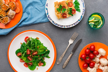 Eating healthy food on gray background, top view.