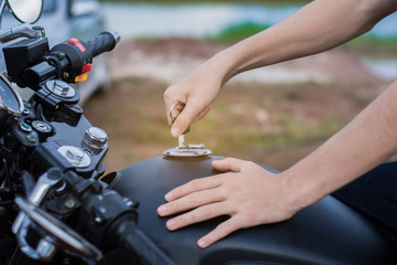 Hand the key open tank cap motorcycle fuel tank.