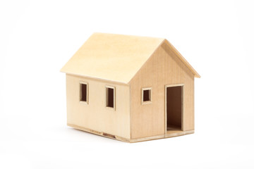 Toy wooden house model on white