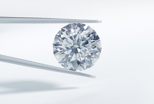 Gro&szlig;er Diamant mit Pinzette vor Wei&szlig;