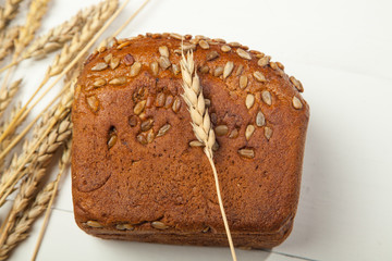 Freshly baked homemade artisan sourdough rye and white flour bread. Sliced. Top view. Close up. Copy space.