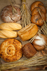 Bread assortment on background of the old canvas