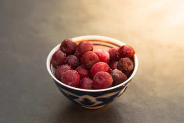 Bowl with frozen cherry berries