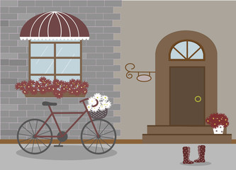 Pretty scenery in a rustic style. House, window with a striped awning, door, stairs, red flowers. Bike and basket of daisies. Rain boots with polka dots. Decorative brick wall. Vector illustration