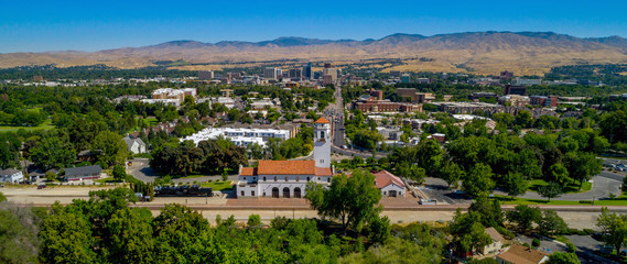 Trees border the Depot with city of Boise Idaho backdrop