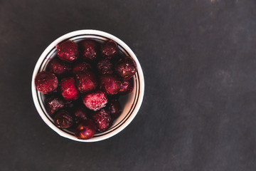 Bowl with frozen cherry berries