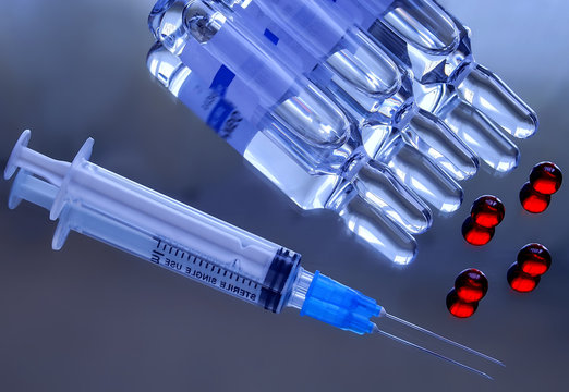 Syringe, ampoules and capsules. Fighting diseases - viral and bacterial.